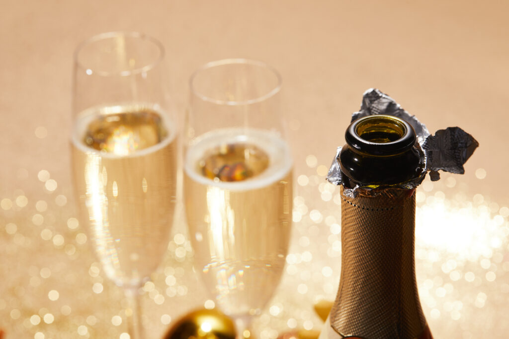 selective focus of open champagne bottle, christmas concept